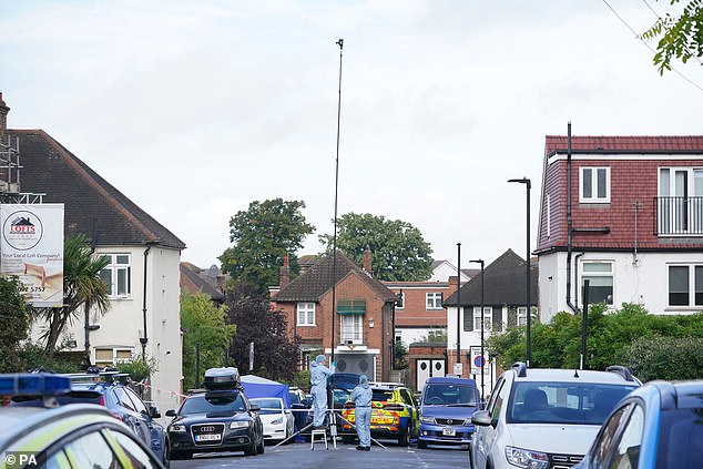 Forensics officers at the shooting scene in Streatham, South London, on September 6, 2022