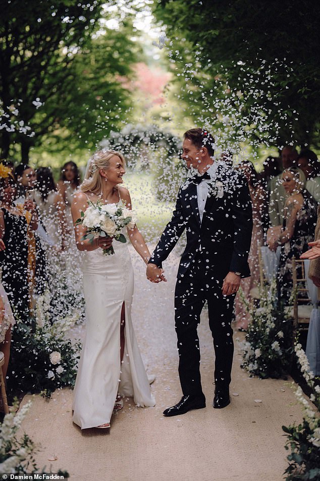 Sam pictured with her husband Kevin on their wedding day. Sam says Kevin 'is super supportive of all our animals'