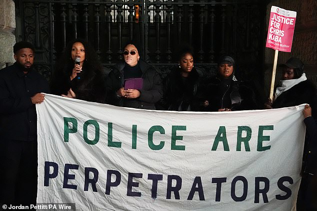 One large banner at tonight's protest reads 'Police are Perpetrators' while another says 'Justice for Chris Kaba'