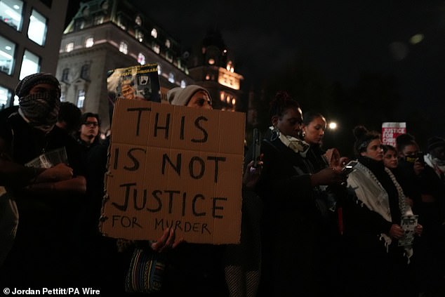 A large sign reads 'This is not justice for murder' at the Chris Kaba protest tonight