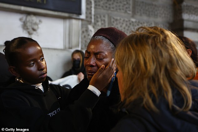 Grieving protesters gather after the trial verdict where Blake was cleared of murdering Mr Kaba at the Old Bailey