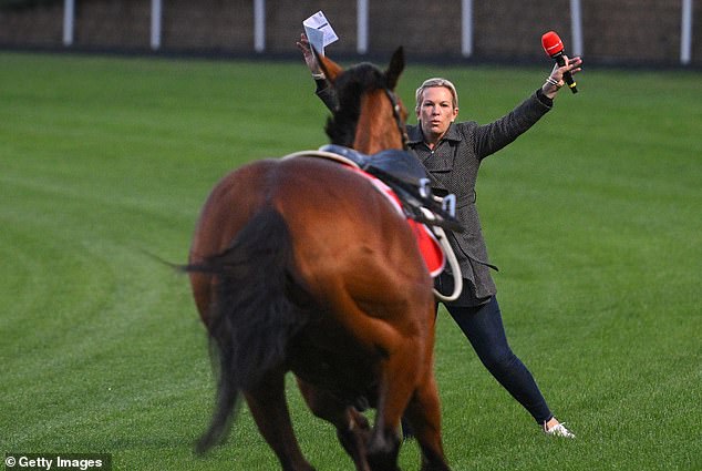 Trainer and TV presenter Amy Yargi trying to stop Via Sistina after James McDonald was unseated on Tuesday at Mooney Valley