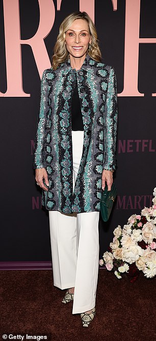 Jamie Tisch, 56, rocked a beaded snakeskin coat and matching heels for the occasion