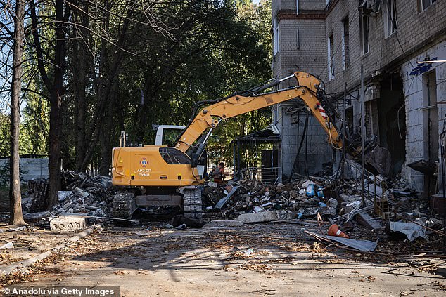 Heavy construction equipment is used to remove debris after a double attack by Russian forces on a hospital in Sumy, Ukraine on September 28, 2024