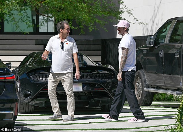 Beckham appears relaxed as he walks into the home with 124ft of frontage on Biscayne Bay