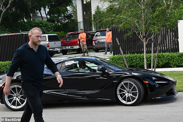 Beckham arrives at the home in his McLaren 750S after purchasing it for £60million