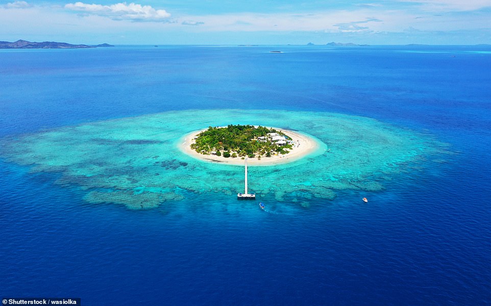 Third-place Fiji 'unfolds across over 330 palm-fringed islands, each a symphony of turquoise waters, vibrant coral reefs and pearl-hued beaches'. Above is Mala Mala island in the archipelago