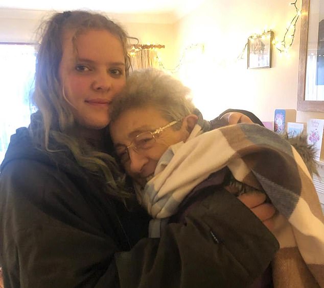 Maureen cuddles in tight with her granddaughter Laura