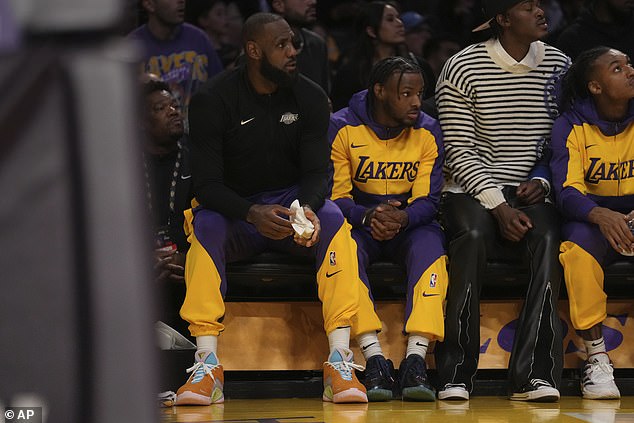 LeBron James and son Bronny watch their Lakers teammates play the Timberwolves