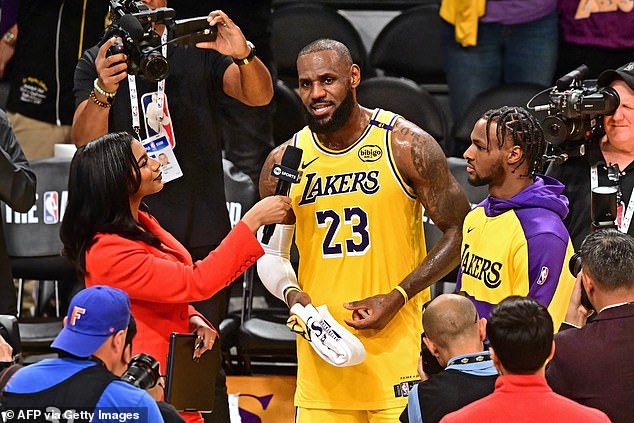 LeBron James and his son Bronny answer questions from TNT Sports after the victory