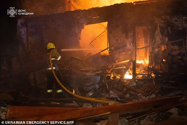 A firefighter working at the site of a Russian drone attack in Sumy amid the Russian invasion of Ukraine on October 22, 2024