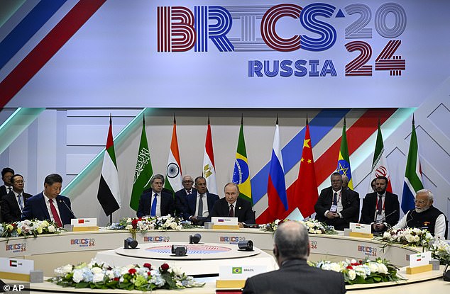 Chinese President Xi Jinping, third left,Russian President Vladimir Putin, center, and Indian Prime Minister Narendra Modi, right, attend the BRICS Summit narrow format session in Kazan, Russia, Wednesday, Oct. 23, 2024