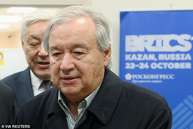 U.N. Secretary General Antonio Guterres takes part in a welcoming ceremony at an airport as he arrives to attend the BRICS Summit in Kazan, Russia October 23, 2024