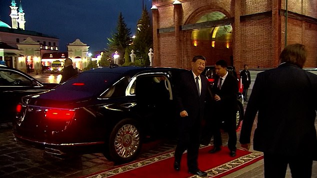 Meanwhile, Jinping was later seen rolling up in his car, and casually getting out before strolling over to the meeting spot