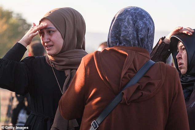 Relatives of employees watch on following an attack on October 23, 2024 in Ankara, Turkey