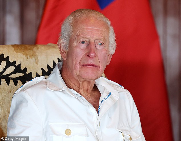 Charles looks on as he attends the official event in Samoa on Wednesday