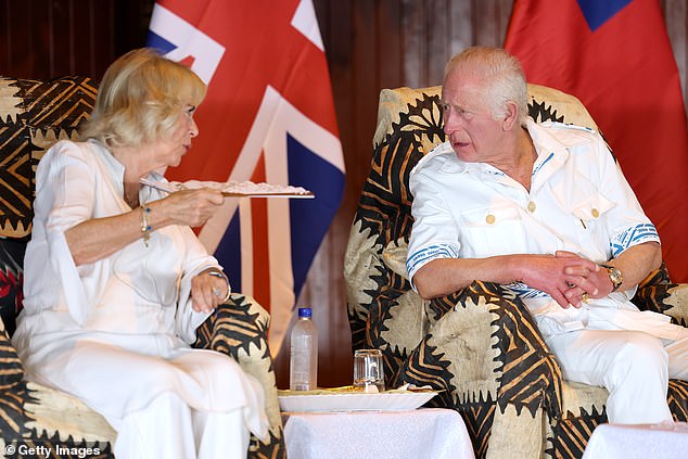 Charles and Camilla talk to each other during the official Royal 'Ava ceremonial' welcome