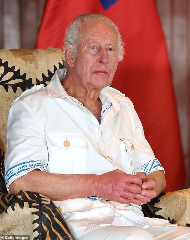 Charles looks on as he attends the official event in Samoa on Wednesday