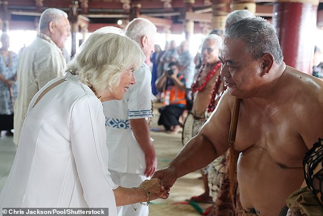 Camilla shakes hands with villagers following the official Royal 'Ava ceremonial' welcome