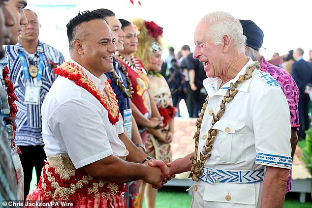 Charles is greeted by students as he attends the formal launch of the King's Commonwealth Fellowships Programme at the National University of Samoa