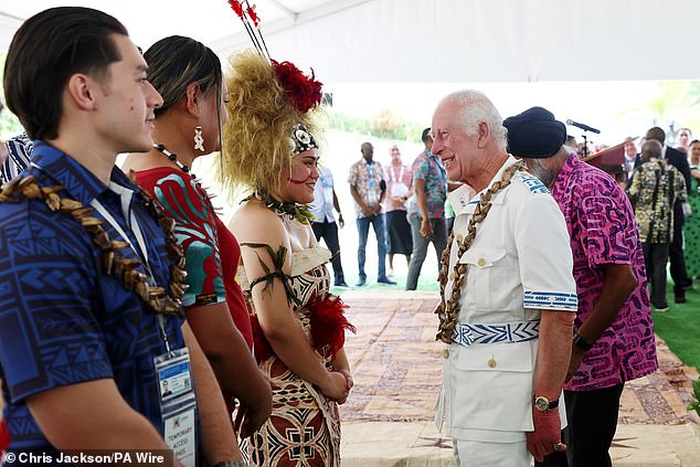 The King is greeted by students as he attends the formal launch on Wednesday