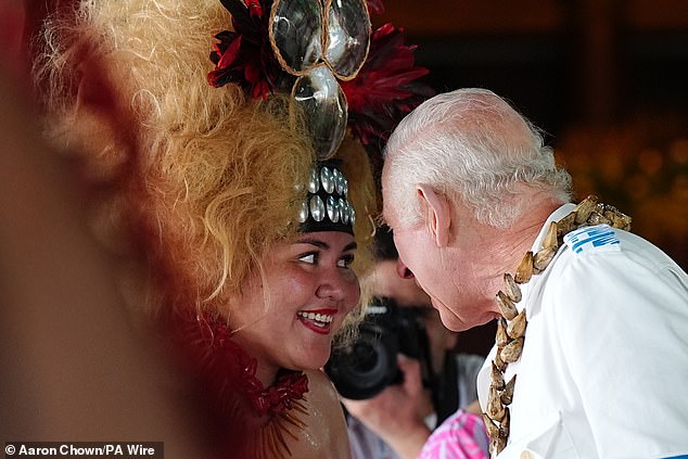 Charles meets members of the Falelatai village following the official royal 'ava ceremonial' welcome