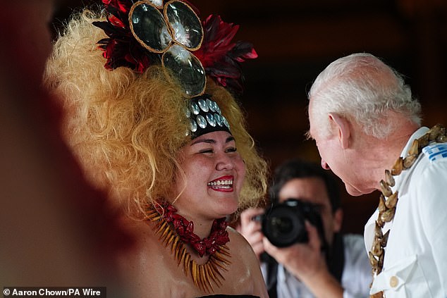 Charles meets members of the Falelatai village following the official royal 'ava ceremonial' welcome