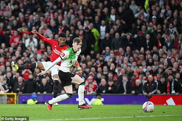 Tsimikas admitted Liverpool weren't the same last season after Amad Diallo (left) won an epic FA Cup encounter for Man United against the Reds