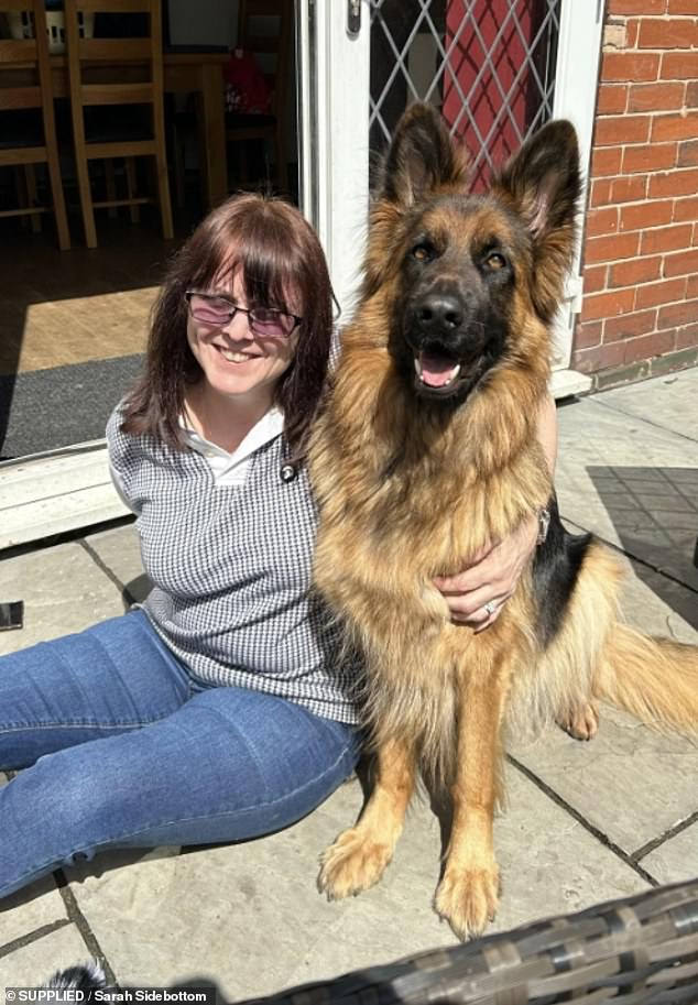 Sarah Sidebottom pictured with her beloved German Shepherd Kayla - who she says has 'pulled her back from the brink'