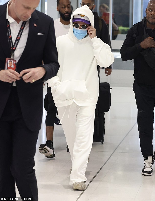 The singer dressed casually for the long flight in white track pants and a matching coloured jumper