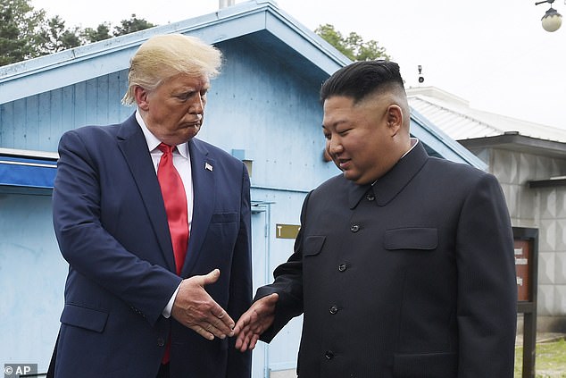 North Korean leader Kim Jong Un, right, and U.S. President Donald Trump prepare to shake hands at the border village of Panmunjom in the Demilitarized Zone, South Korea, June 30, 2019