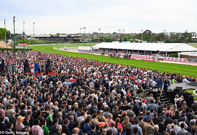 A capacity crowd is tipped to watch the Cox Plate live, which was first staged in 1922 (pictured, racegoers trackside last year)