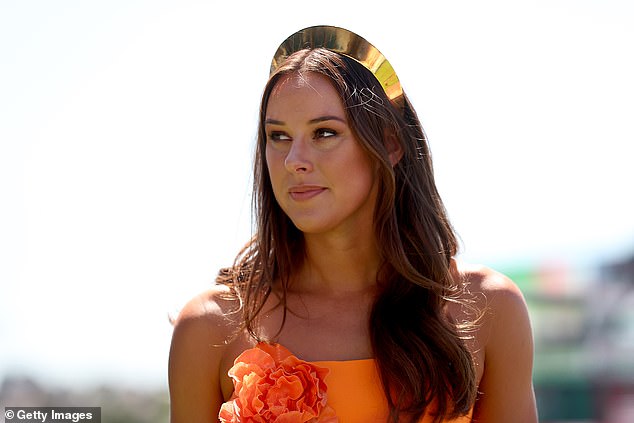 In line with the bold dress code, Brianna, 28, put on a sophisticated display in an equally vibrant orange strapped dress, which was adorned with huge flowers