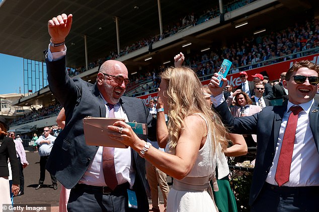 They were in attendance for Cox Plate Day, which has a purse of $5million and sees horses aged three years old and over rase over a distance of 2,040 metres (racegoers are pictured)