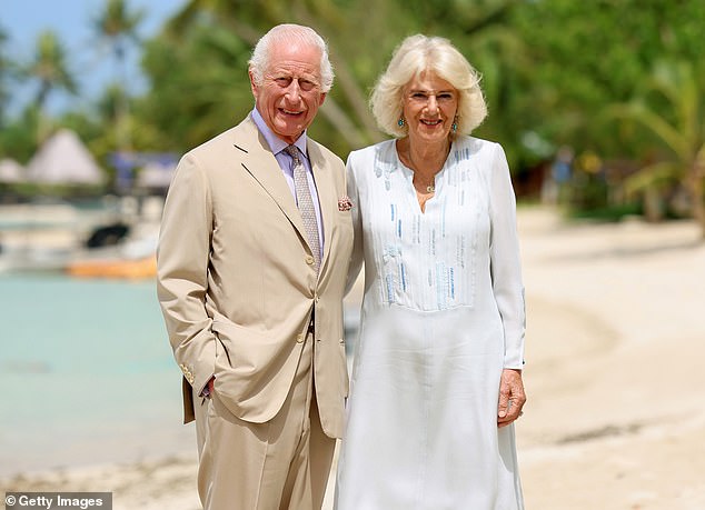 Camilla wore a white, linen dress with detailing in several shades of blue for the photographs, while Charles opted for a tan, linen suit - with a matching shirt and tie