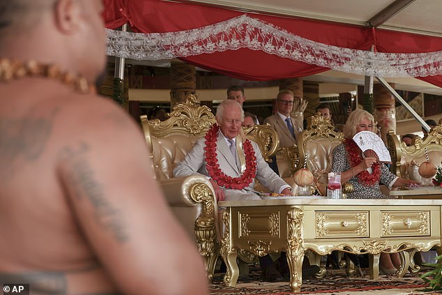 The King was honoured with the chiefly title of To'aiga-O-Tumua by the village's high chief, as he and Camilla were presented with sacred kava in coconut shells with straws