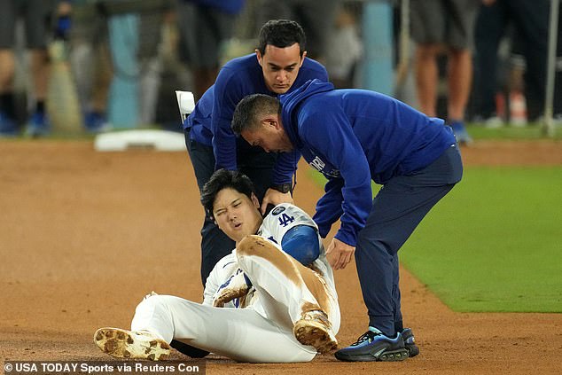 Ohtani reacts after injuring his shoulder against the New York Yankees in the seventh inning