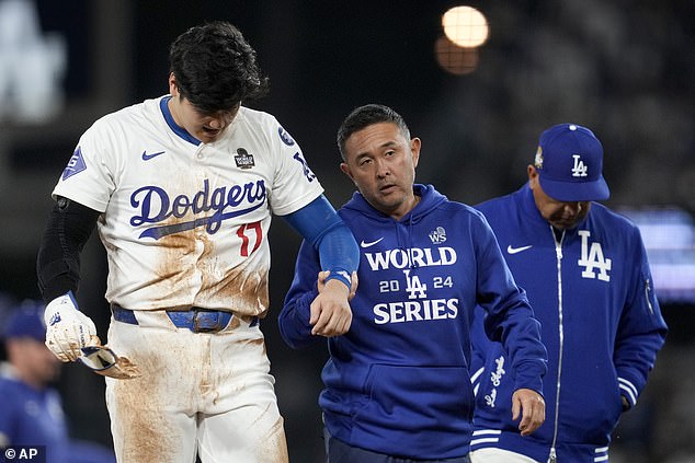 Ohtani Ohtani is helped off the field after getting hurt during the seventh inning in Game 2