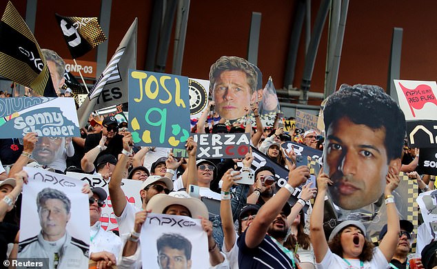 Spectators held cardboard cutouts of Brad as they cheered on his fictional Apex Grand Prix team