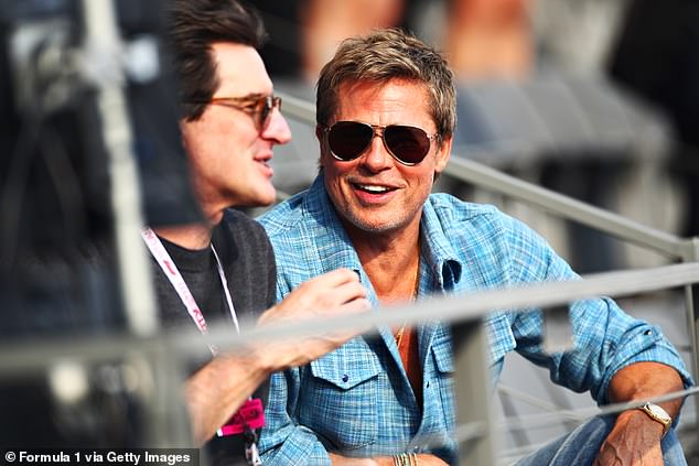 Brad Pitt jokes around while in the grandstand at the F1 Grand Prix of Mexico