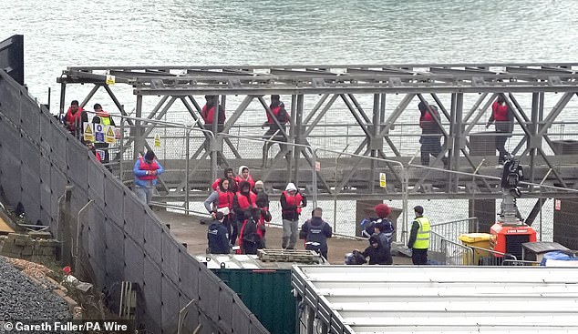 A group of people thought to be migrants are brought in to Dover, Kent, from a Border Force vessel following a small boat incident in the Channel on October 15, 2024