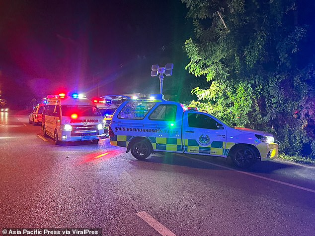 Police and ambulance services are seen at the site of the crash on October 21