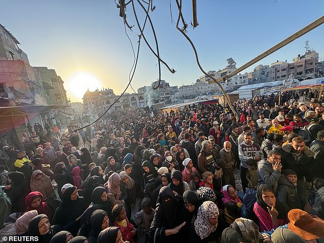 Palestinians gather to buy bread from a bakery, amid the Israel-Hamas conflict, in Khan Younis, in the southern Gaza Strip October 28, 2024