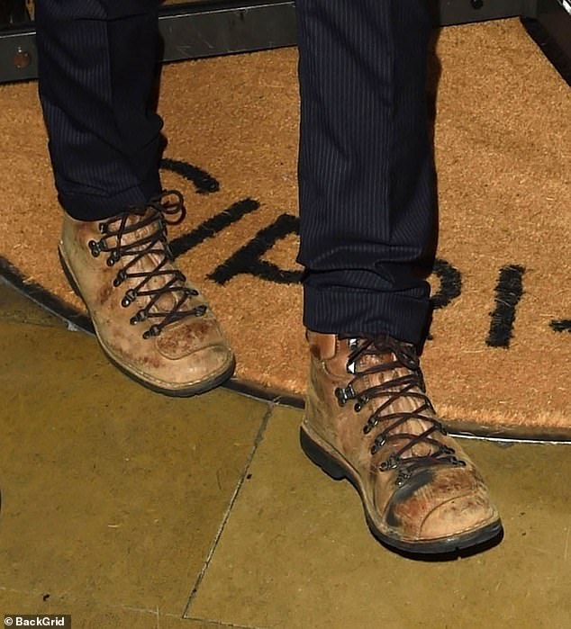 The actor dressed down his dapper ensemble with scruffy brown boots as he was seen departing the restaurant with Alexandra