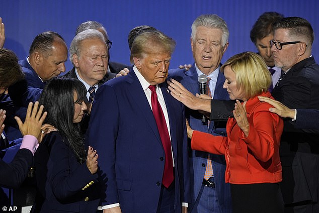 Pastor Paula White spoke as some of his advisors and supporters prayed with their hands around him