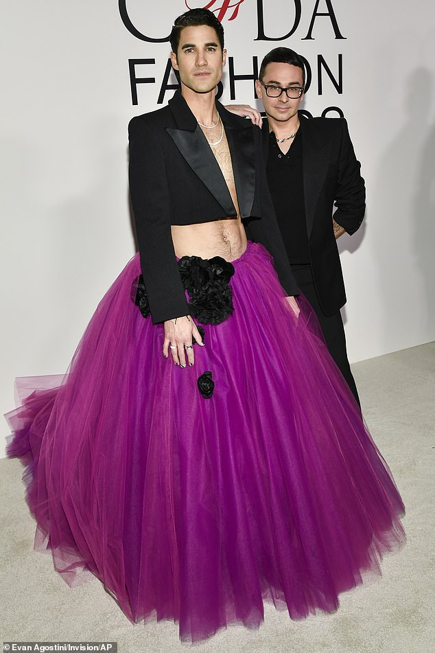 Darren Criss wore a cropped black blazer as well as a full, purple tulle skirt while crossing paths with designer Christian Siriano