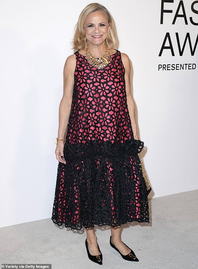 Amy Sedaris was stylish in a pink and black floral dress that fell down past her knees and slipped into a pair of black flats