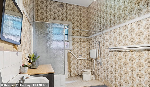 A large crowd turned out for the auction on Sunday but only two of four registered bidders made an offer on the fixer-upper. Sales agents for O'Brien said they were negotiating with the highest bidder and were hoping to secure a sale in the next few days reported The Advertiser on Sunday. Pictured: On of two bathrooms in the seaside fixer upper