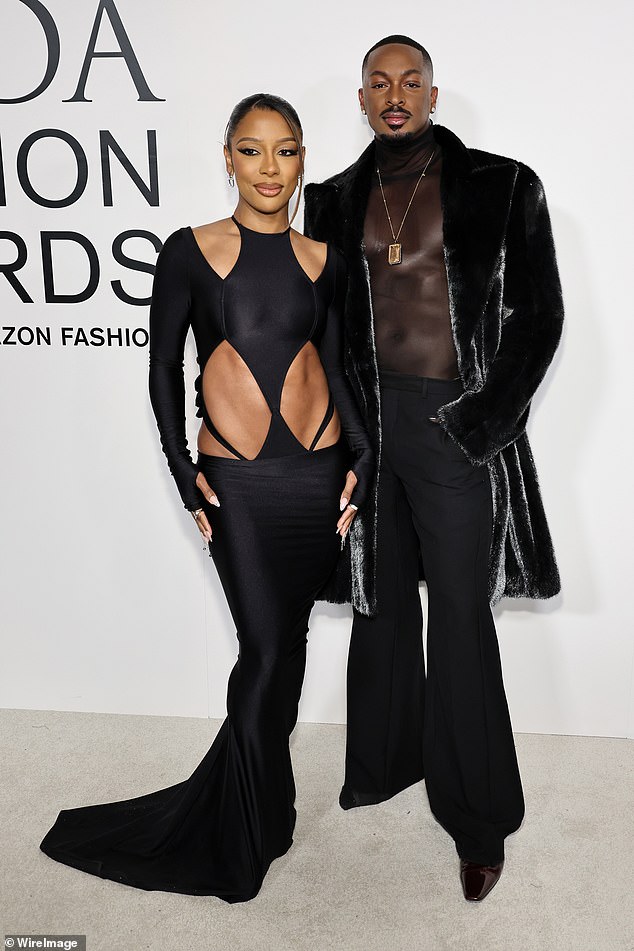 Victoria Monet was also joined by LaQuan Smith who donned a sheer black shirt as well as a pair of loose-fitting trousers and a fuzzy, black coat