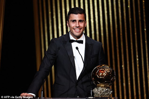 Manchester City's Spanish midfielder Rodri receives the Ballon d'Or award during the 2024 Ballon d'Or France Football award ceremony at the Theatre du Chatelet in Paris on October 28